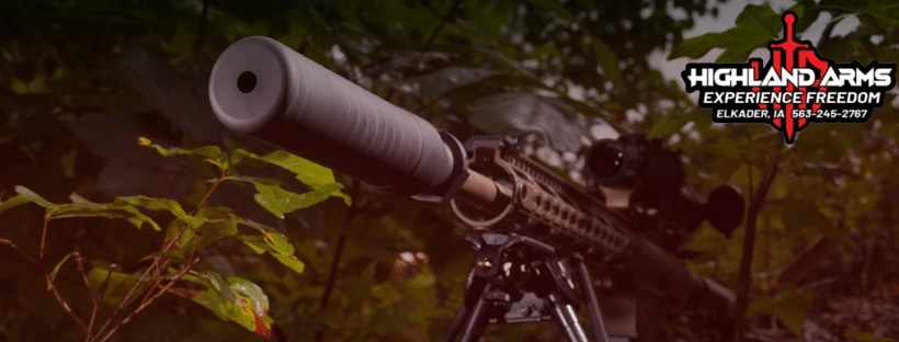 Rifle in the bush with suppressor